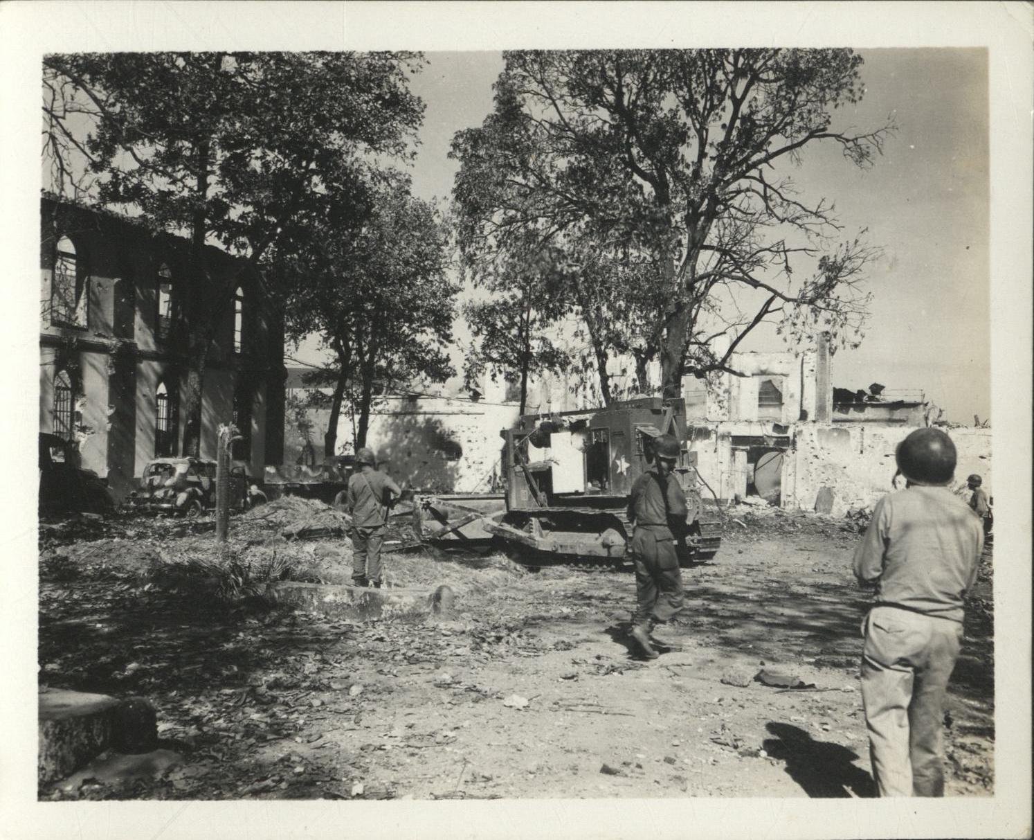 [Untitled – Destruction during liberation of Manila: Army bulldozer clears away rubble, February 1945].