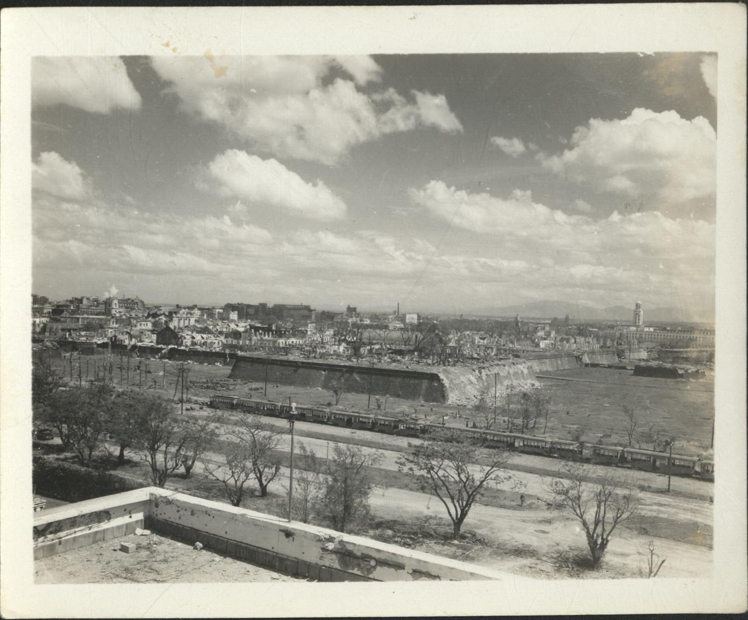 [Untitled – Destruction of Manila during liberation: View atop Manila Hotel toward Intramuros, Aquarium, and City Hall, February 1945].