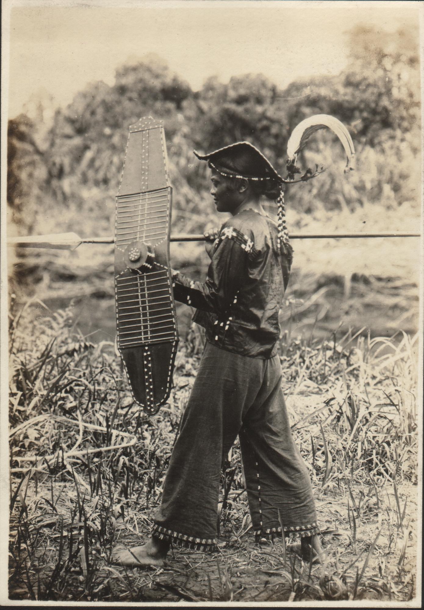 Mandaya man (Inca) using a spear and a shield. Compostela, upper Agusan River, Davao District, Moro Province.