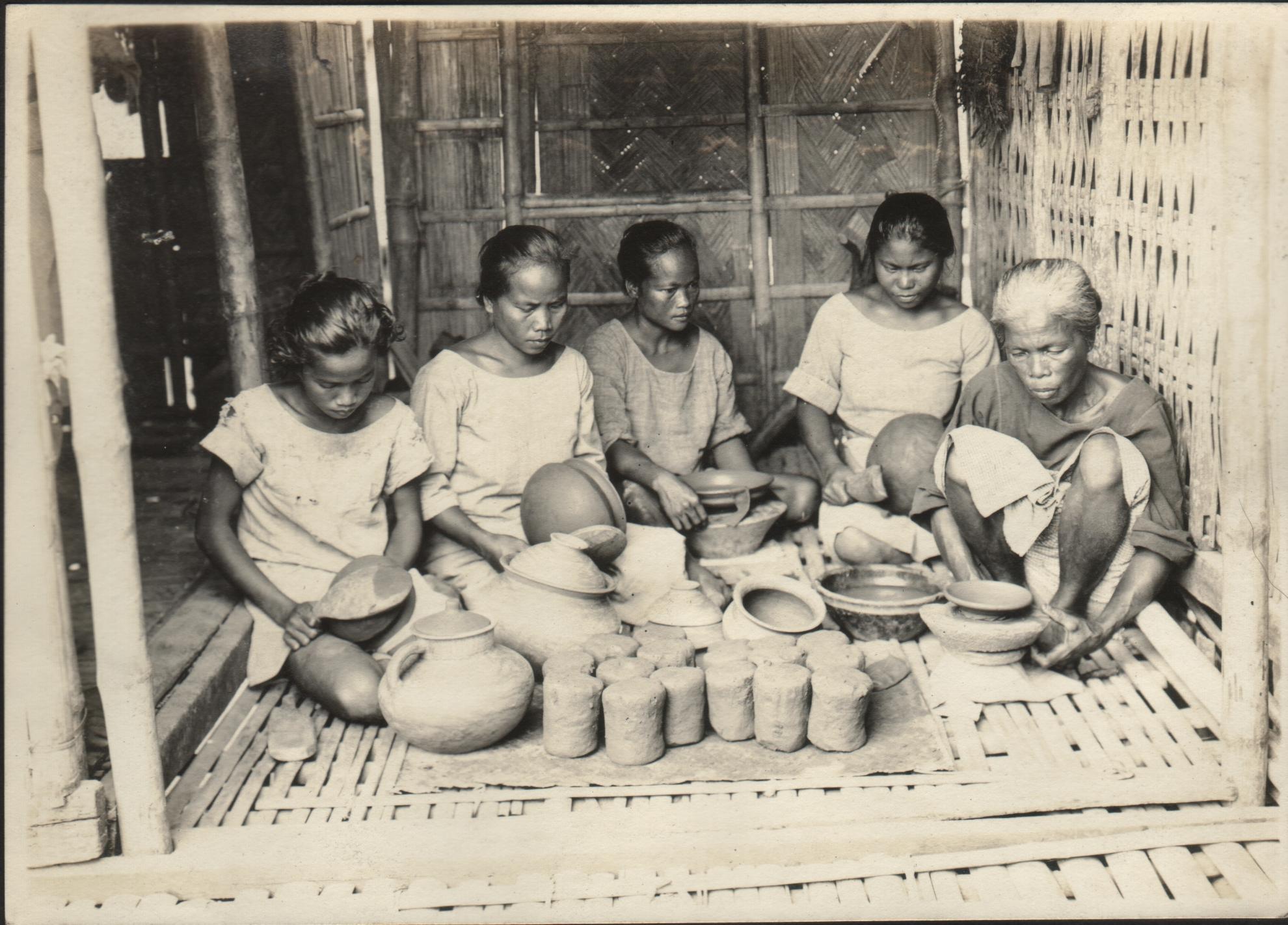 Group of women working pottery. San Nicolas, Ilocos Norte.