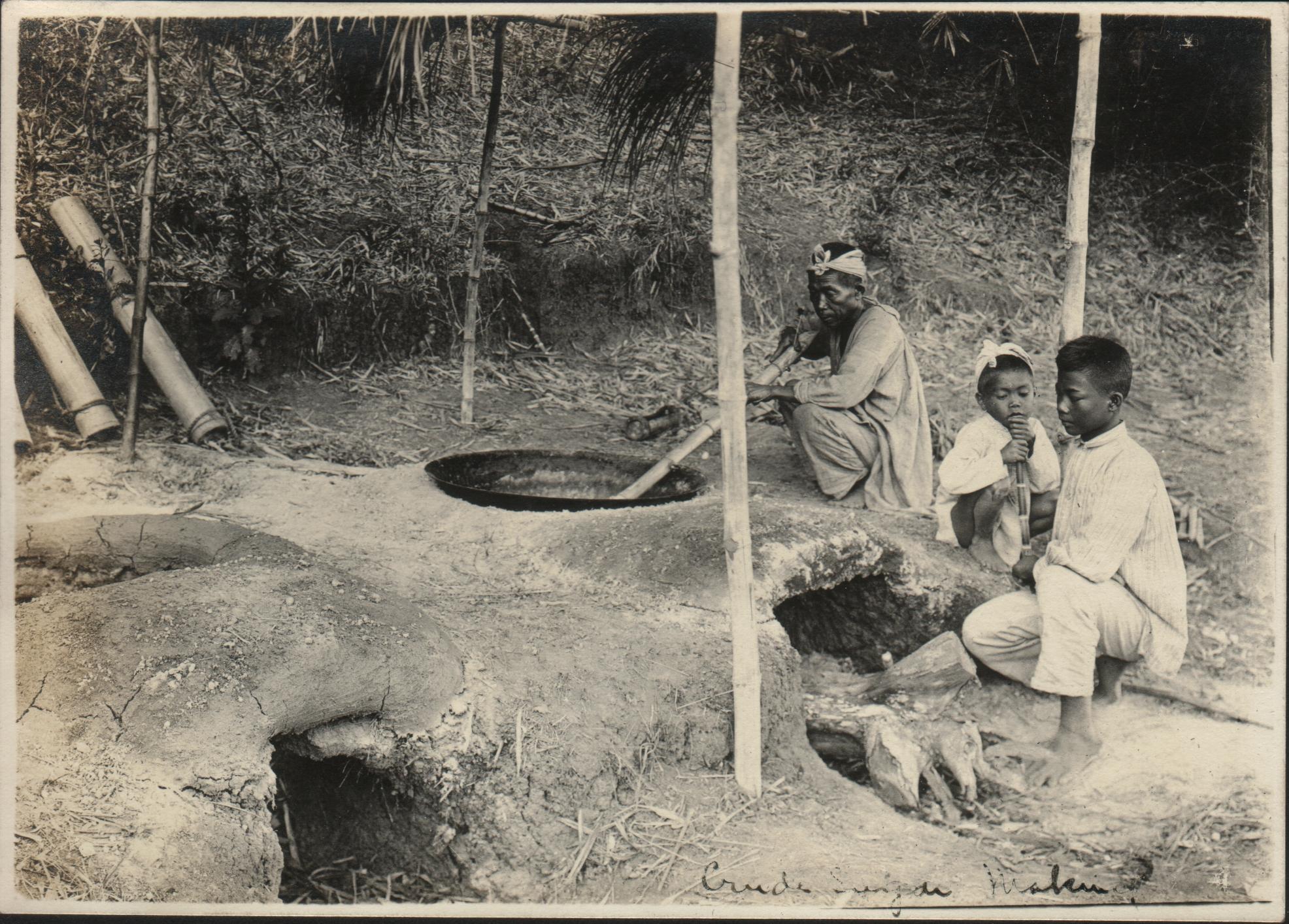 An Ilocano man cooking sugar juice. Barrio Cabisuculan, Vintar.