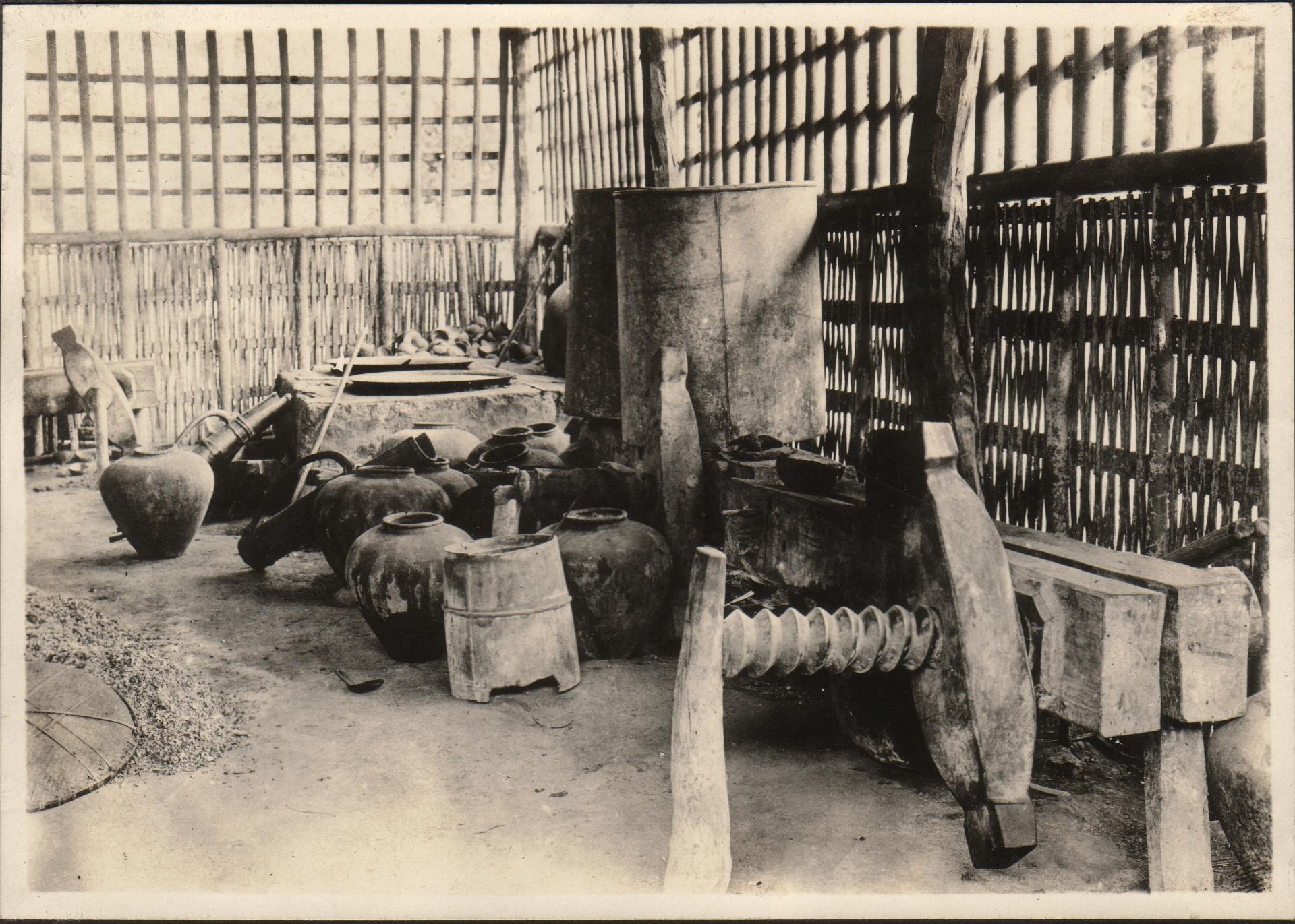 An excellent view of the ansive [?] primitive copra press showing screw.