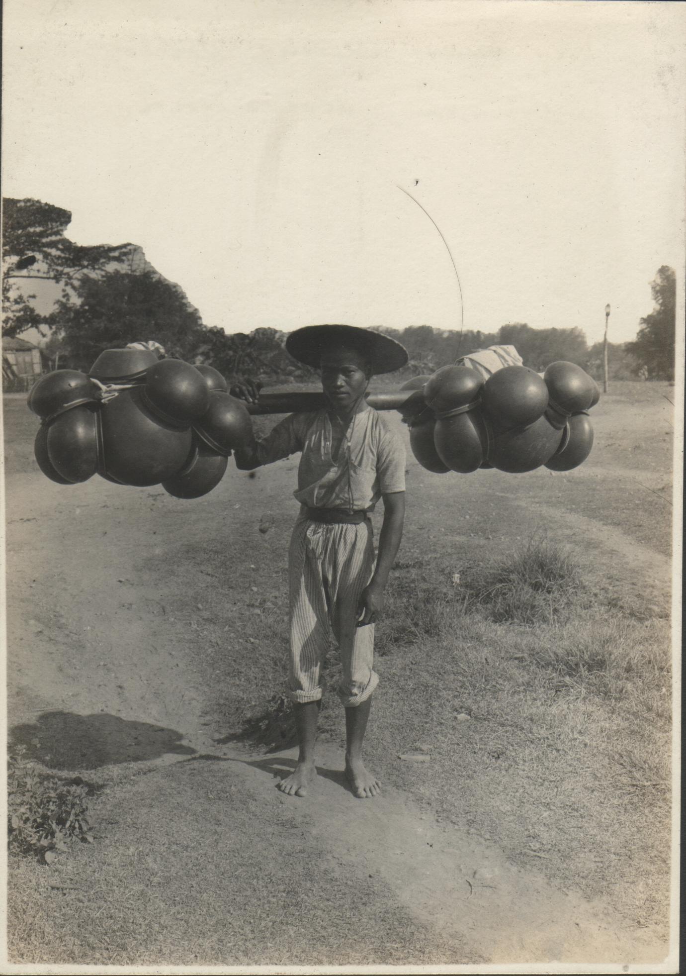 A man selling pottery. Dingras, Ilocos Norte.
