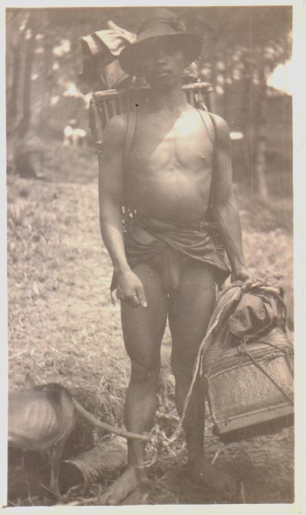 [Untitled – Igorot man with backpack and dog].