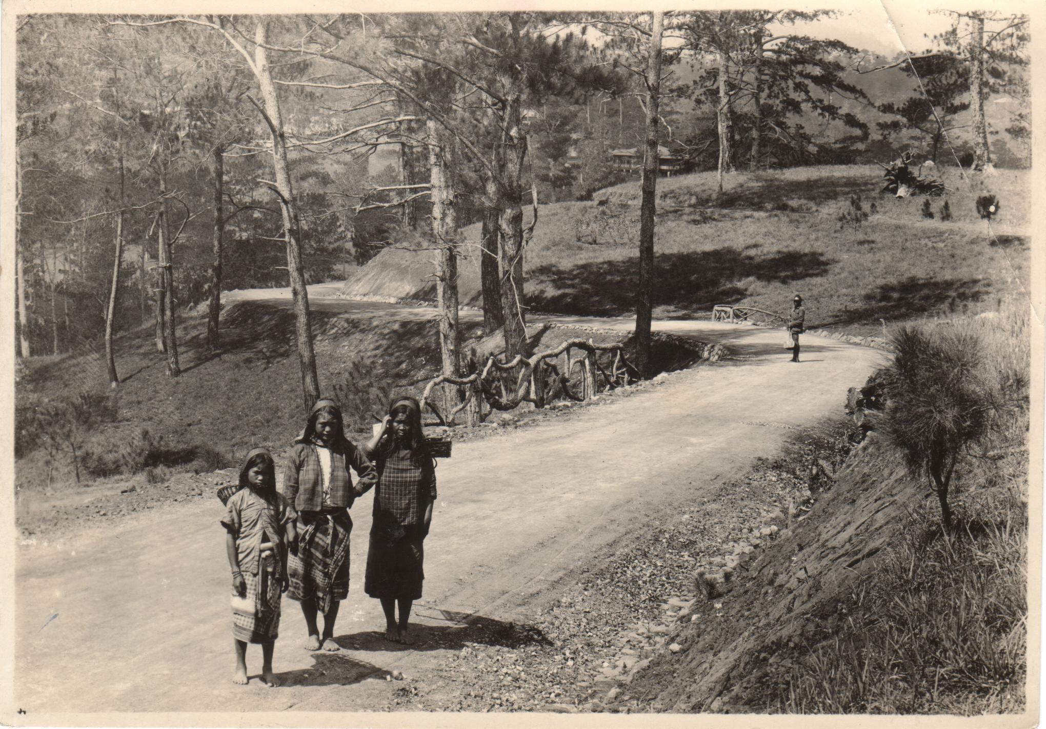 Road in the pines, Baguio. Igorot women.