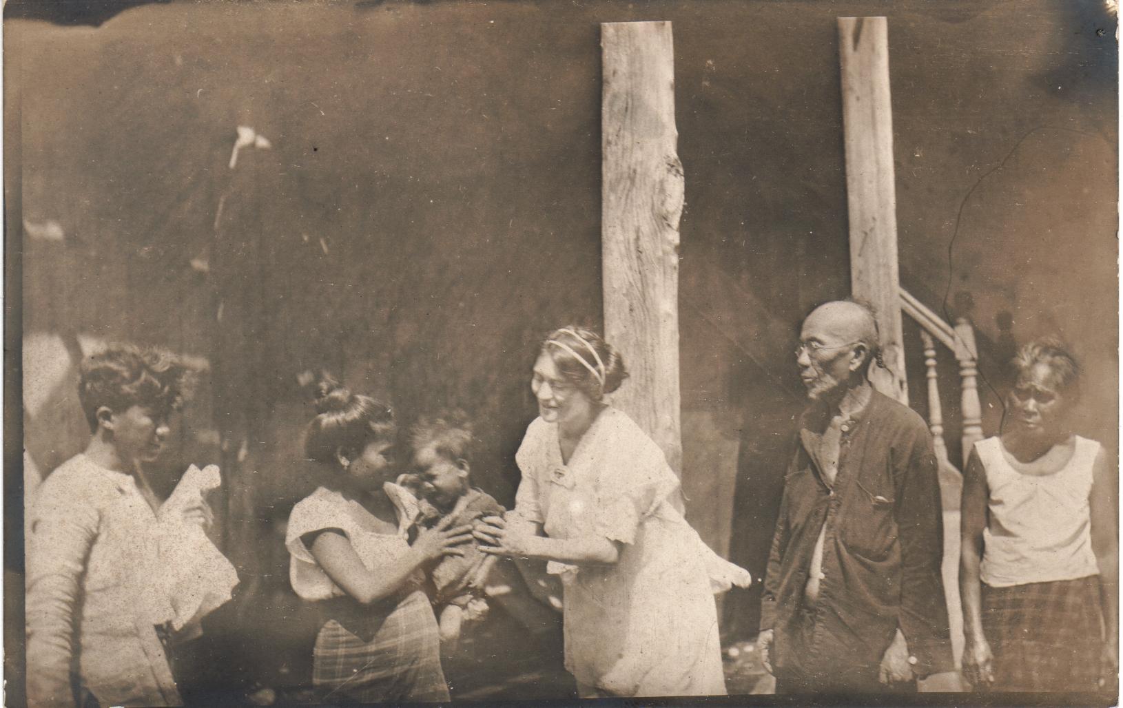 [Untitled – Filipino family with a crying infant].