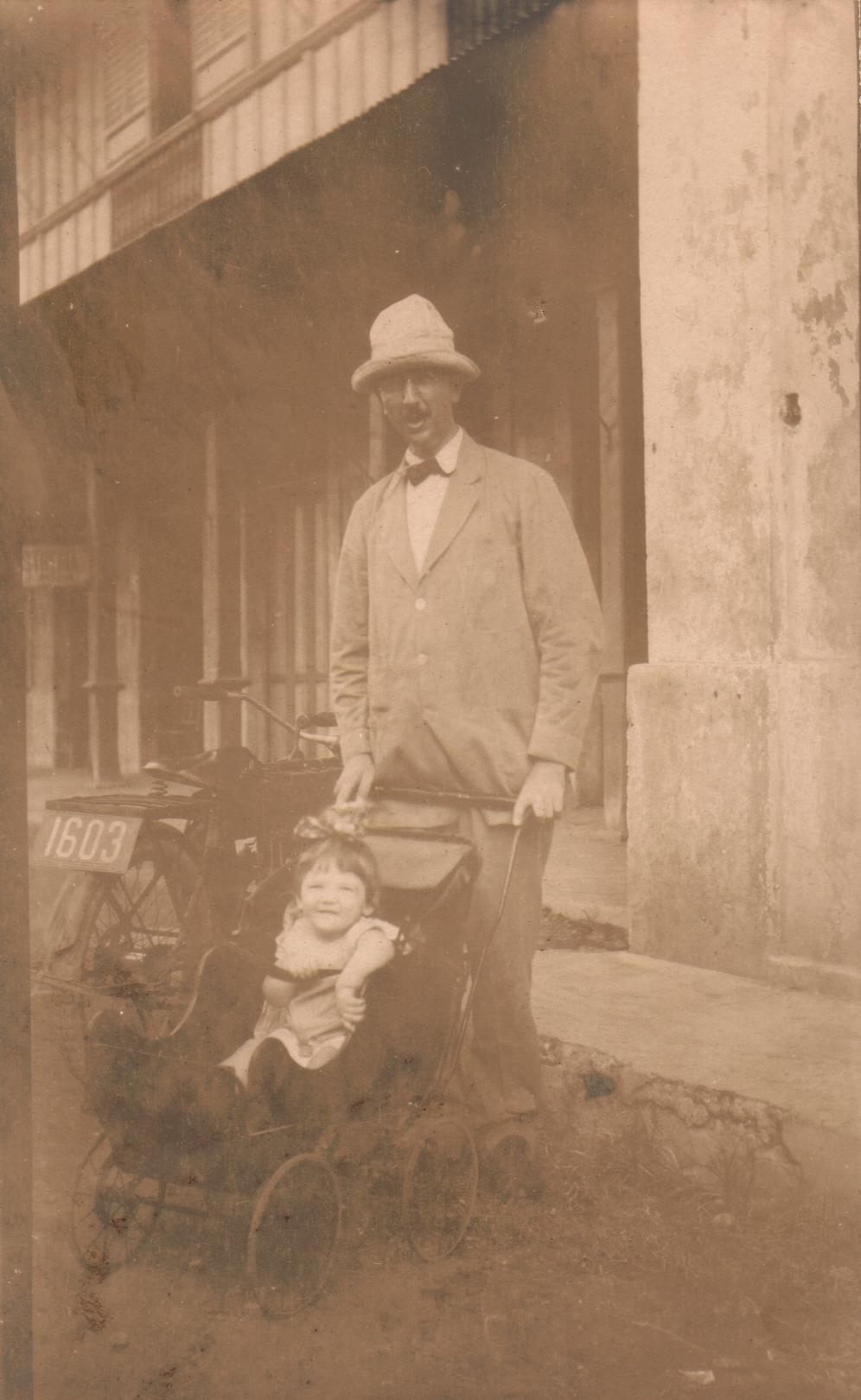 [Untitled – Man with baby in a pram or stroller].