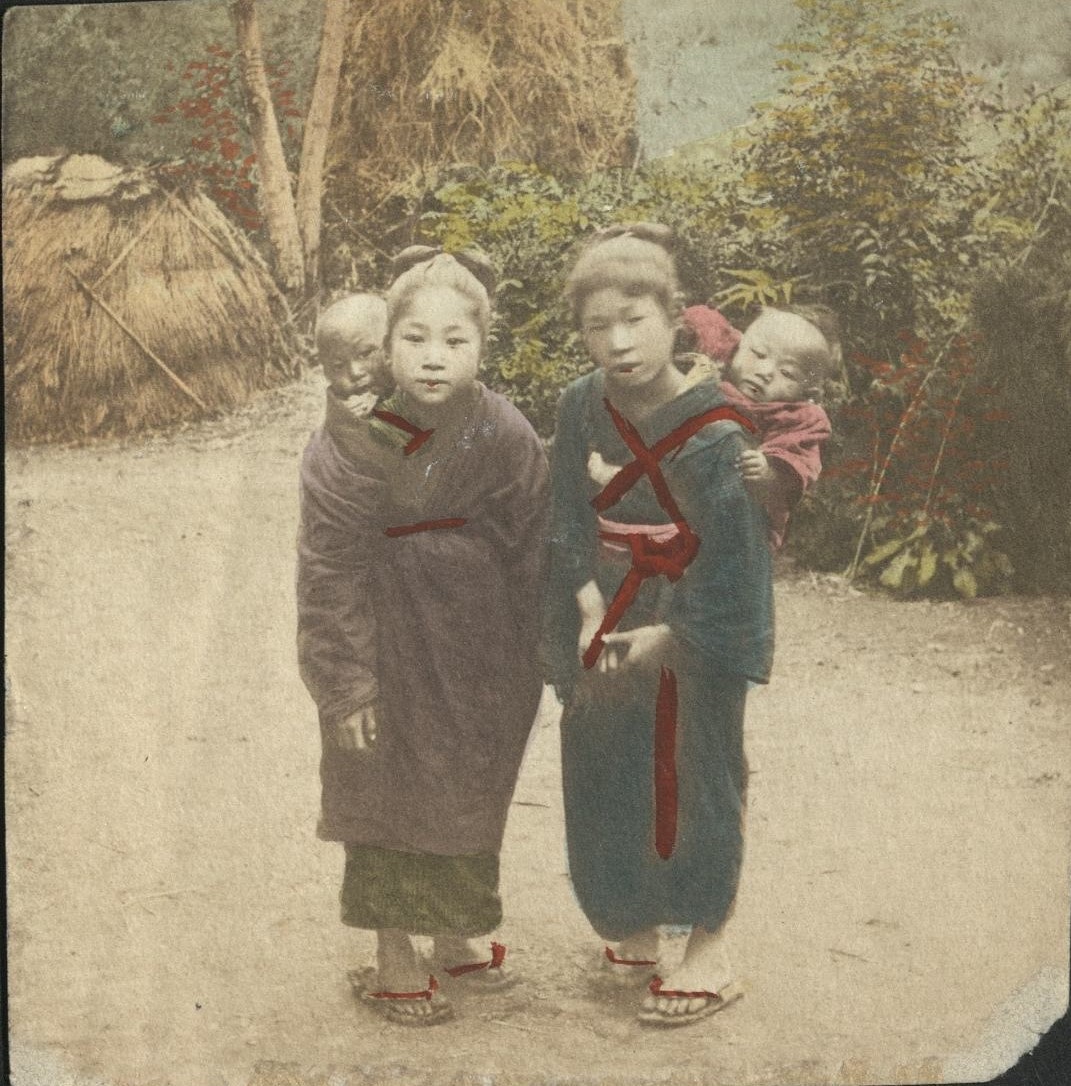 [Untitled – Two Japanese women carry their babies in onbuhimo on their backs].