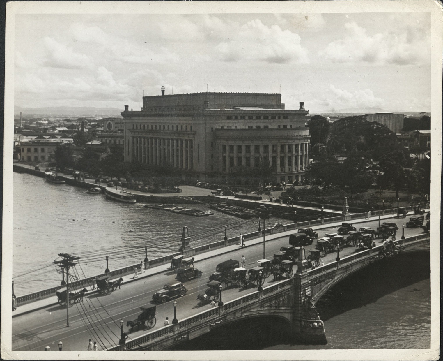 90. PHILIPPINES: Back view of the General Post Office in Manila as seen from across the Pasig River spanned by the Jones Bridge.  J-966.