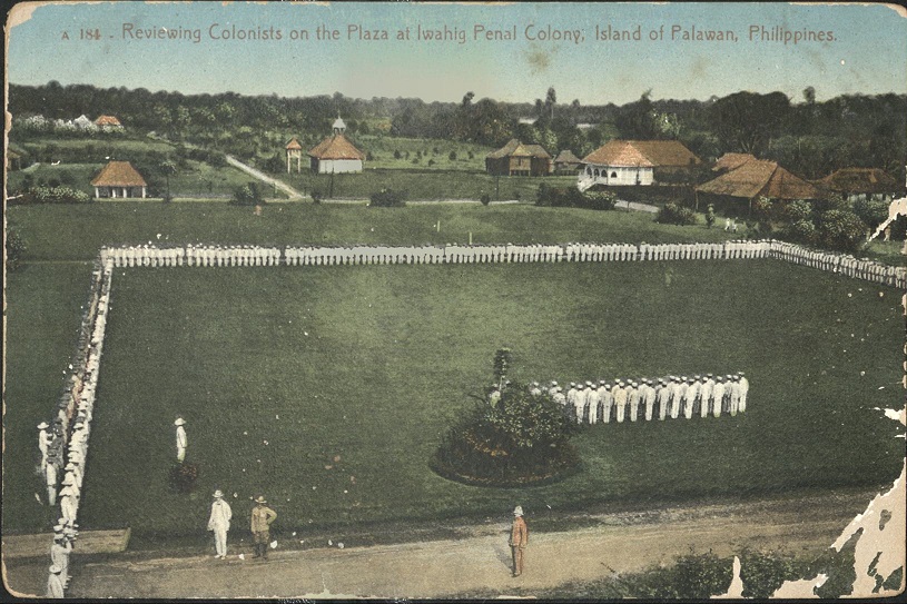 A 184 ï¿½ Reviewing Colonists on the Plaza at Iwahig Penal Colony, Island of Palawan, Philippines.