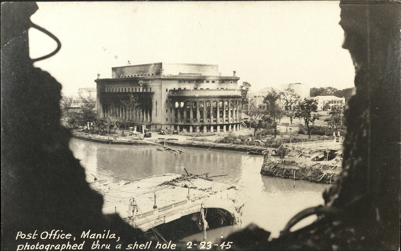 Post Office, Manila, photographed thru a shell hole 2-23-45.