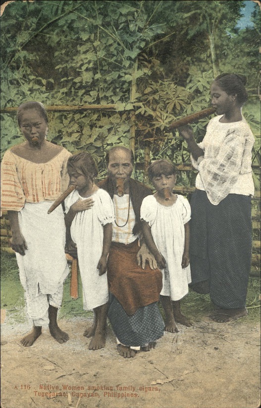 Native women smoking family cigars, Tugegarao, Cagayan, Philippines.