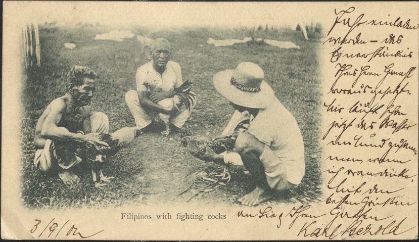 Filipinos with fighting cocks.