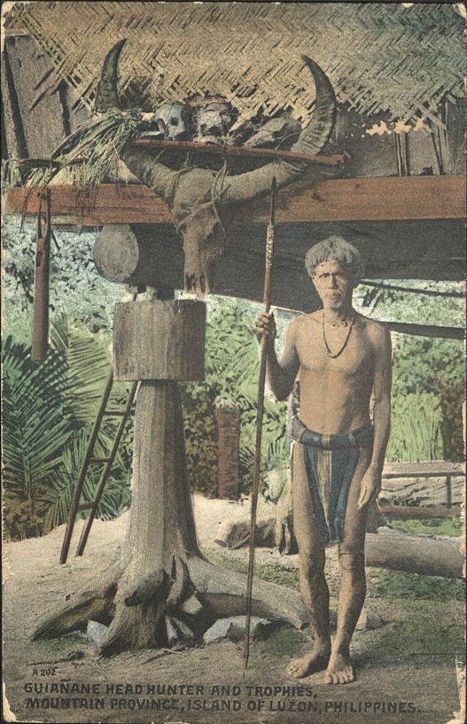 A 202 ï¿½ Guianane Head Hunter and Trophies, Mountain Province, Island of Luzon, Philippines.