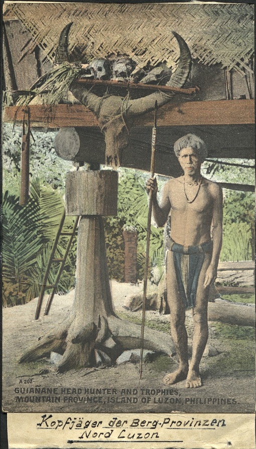 A 202 ï¿½ Guianane Head Hunter and Trophies, Mountain Province, Island of Luzon, Philippines.