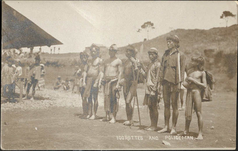 Igorottes [Igorots] and Policeman.