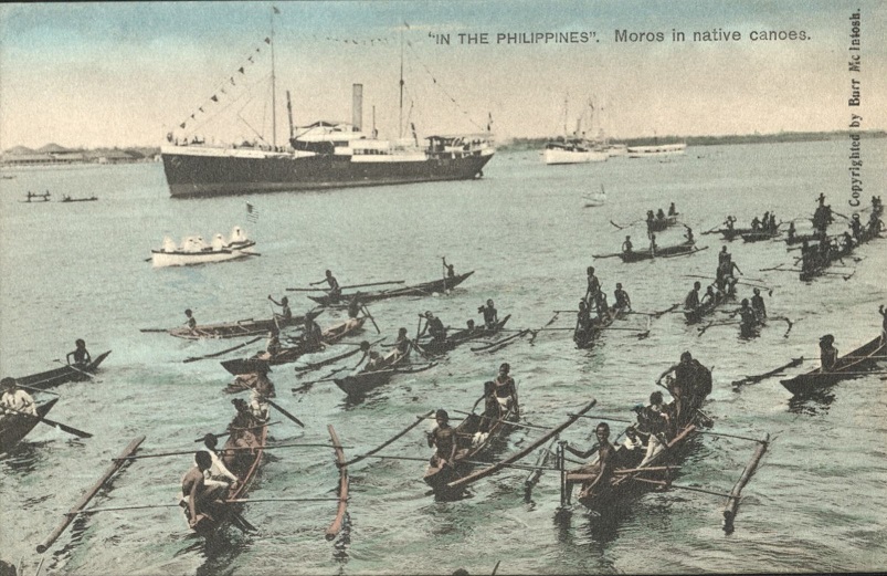 �IN THE PHILIPPINES�. Moros in native canoes.
