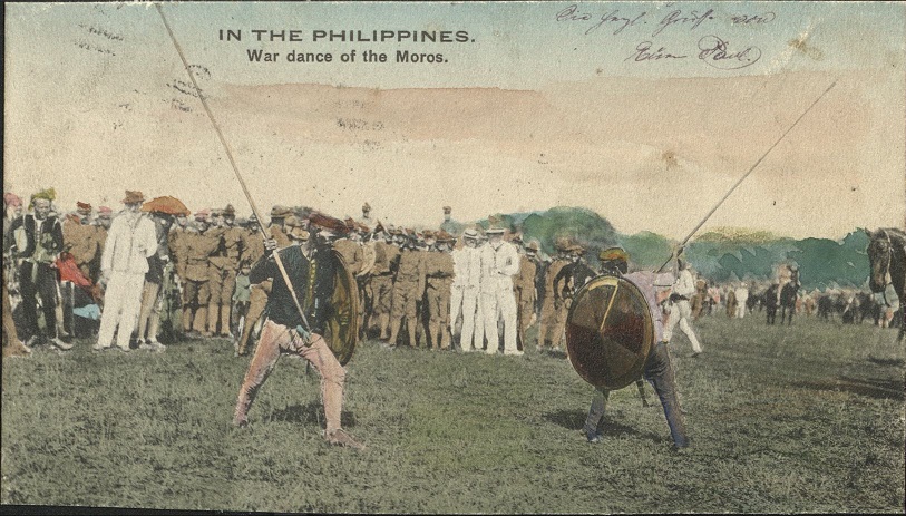 �IN THE PHILIPPINES�. War dance of the Moros.