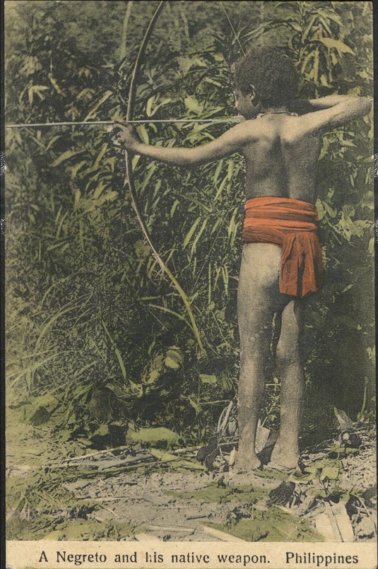 A Negreto [Negrito – Aeta] and his native weapon. Philippines.