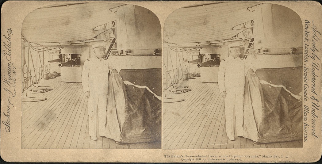 The Nation’s Hero – Admiral Dewey on his Flagship “Olympia,” Manila Bay, P. I.