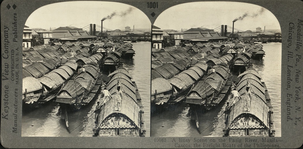 A Busy Scene on the Pasig River, Manila – Cascos, the Freight Boats of the Philippines.