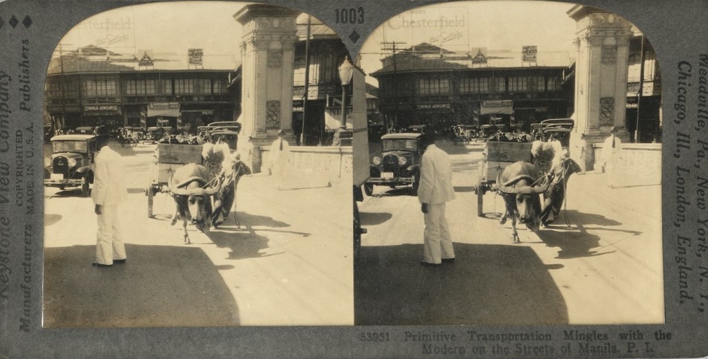 Primitive Transportation Mingles with the Modern on the Streets of Manila, P. I.